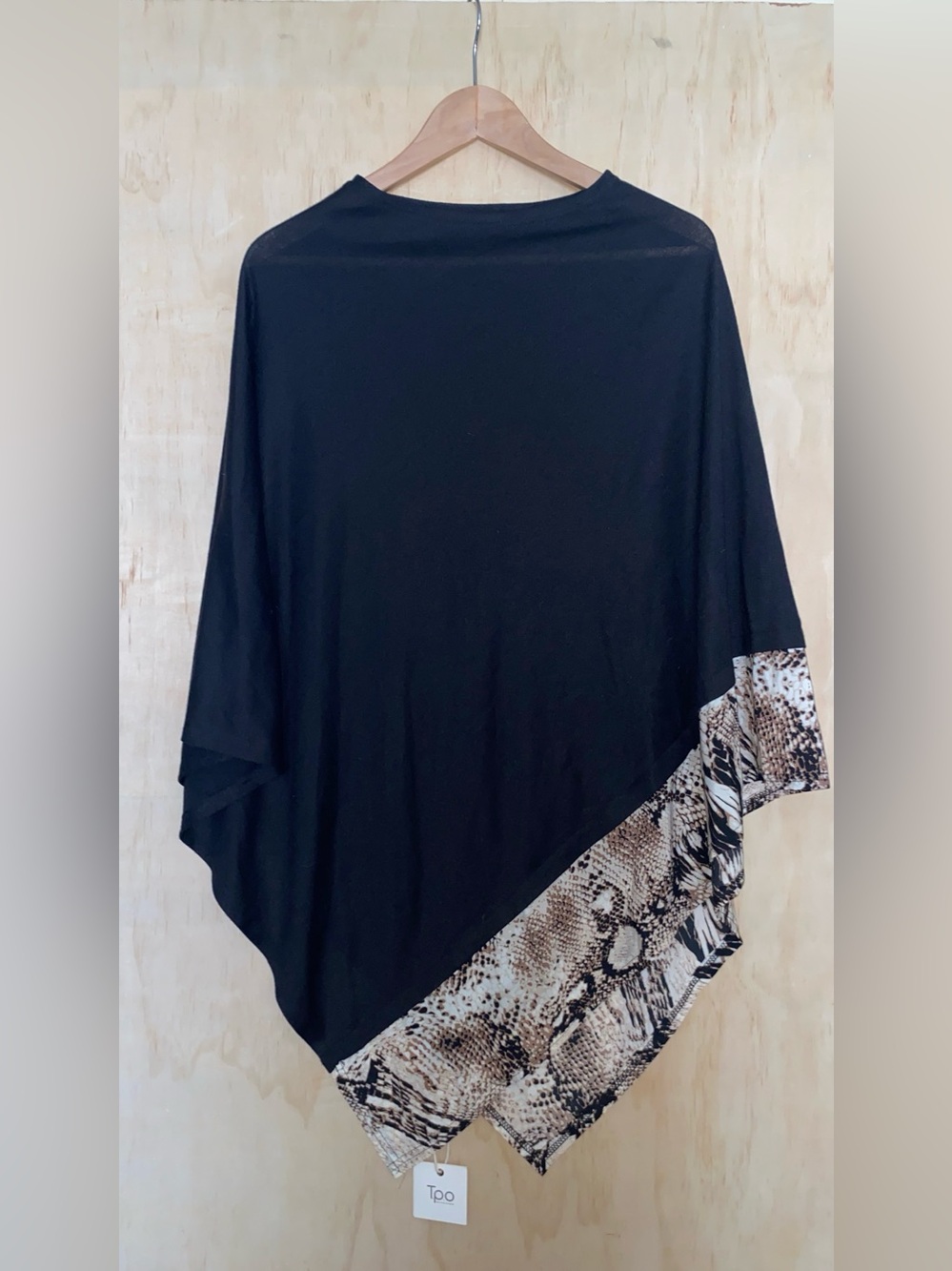 Black Poncho with Snake-Print Hem by